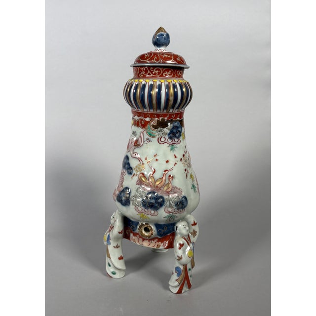 Imari Porcelain Tripod Fountain, Japan, Edo Period (1603-1868) 17th-18th Century Porcelain fountain with Imari relief...
