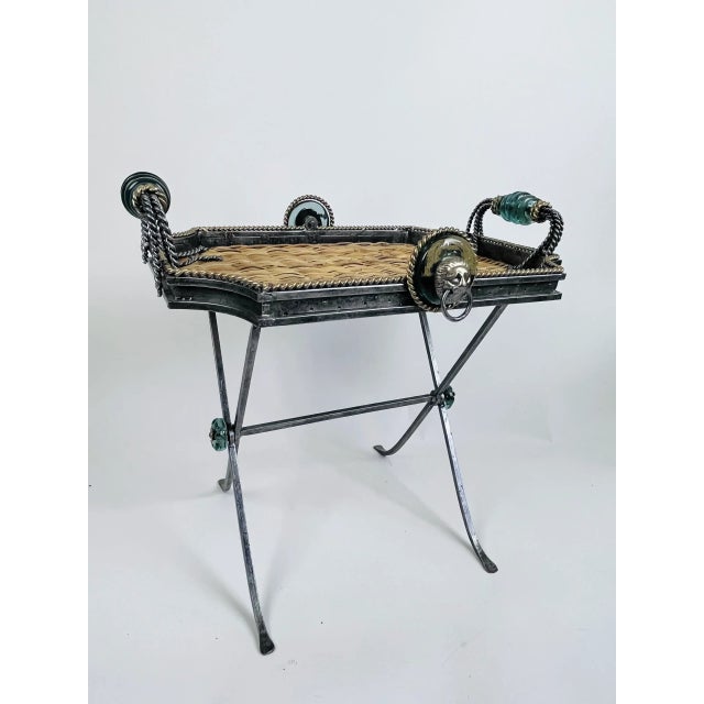 This vintage designer tray table by Maitland-Smith features an overall metal foundation with wicker inlay, greenish/gray...