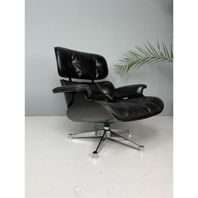 Rare and elegant all-black edition of the iconic Eames Lounge Chair, produced by Herman Miller. This version features...