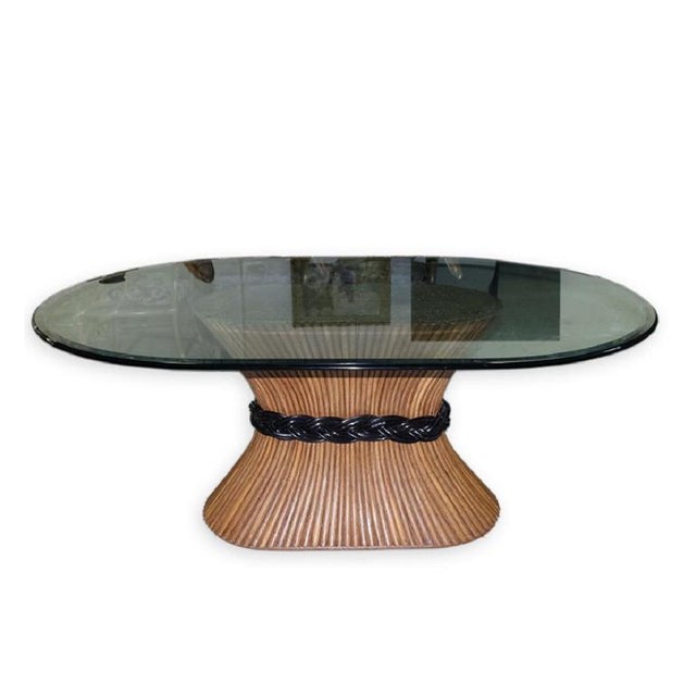 Mid Century Trompe L’ Oeil Rattan or bamboo long oval Pedestal Dining Table with glass top by McGuire. This long piece can...