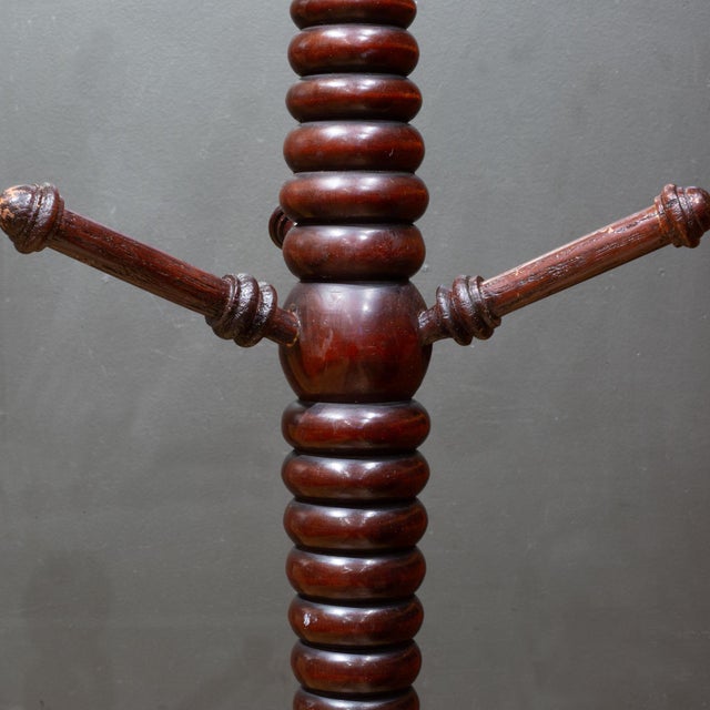 ABOUT Contact us for a customized shipping quote. Antique ribbed mahogany wood coat rack with four legged base. CREATOR...