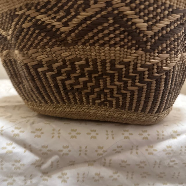 Vintage Tonga basket handwoven by artisans of the Tonga people of Southern Africa using traditional twining techniques...