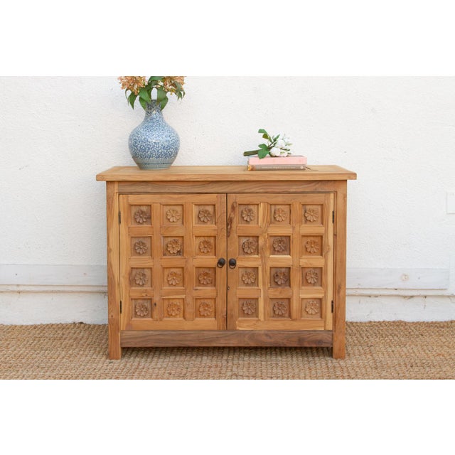 This charming cabinet brings the rhythmic majesty of Indian architecture to a versatile piece of furniture. The intricate...