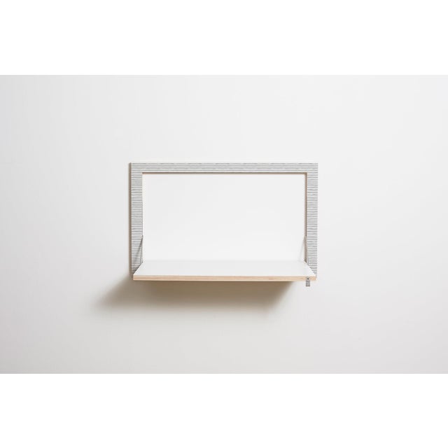 Wall art, workstation functional and discreet, this fläpps wall desk makes the perfect seated or standing workstation...