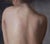 Eve by Kelly Birkenruth | Oil on Panel Back of a woman with lace detail on jeans. For Sale - Image 4 of 5