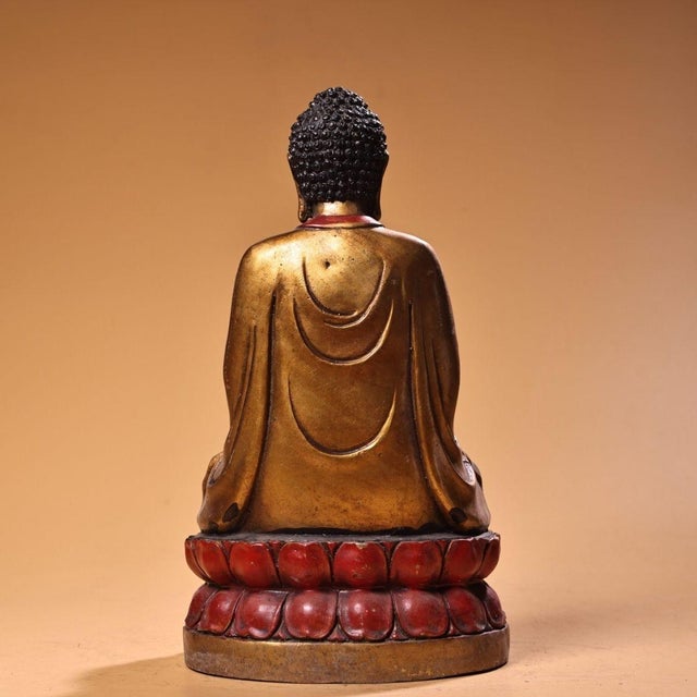 This is a magnificent vintage Chinese gilt bronze statue of Shakyamuni Buddha. The figure is seated in the full lotus...