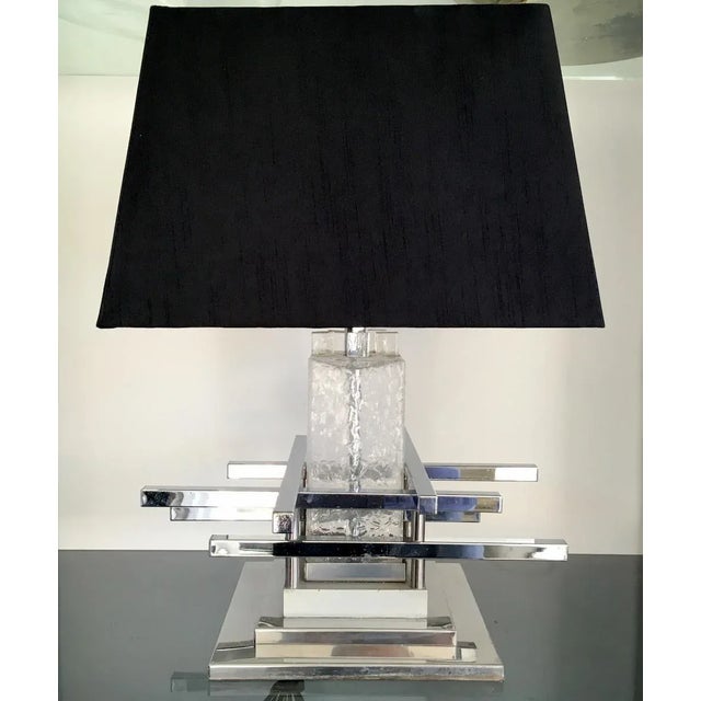 - Chrome and glass table lamp - Chrome bars and base - Glass middle - Produced in Italy - Can be rewired and PAT tested...