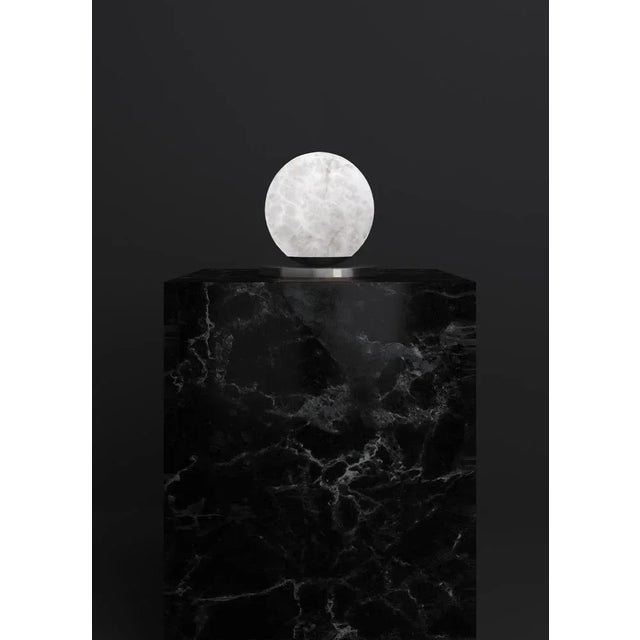 Ofione shiny black metal table lamp by alabastro italiano dimensions: d 16 x w 16 x h 16 cm. Materials: white alabaster...