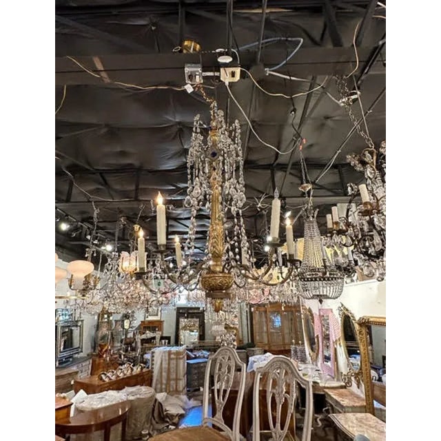 Lovely 18th century Italian giltwood and crystal chandelier from Genoa. Featuring a beautiful carved base with a nice...