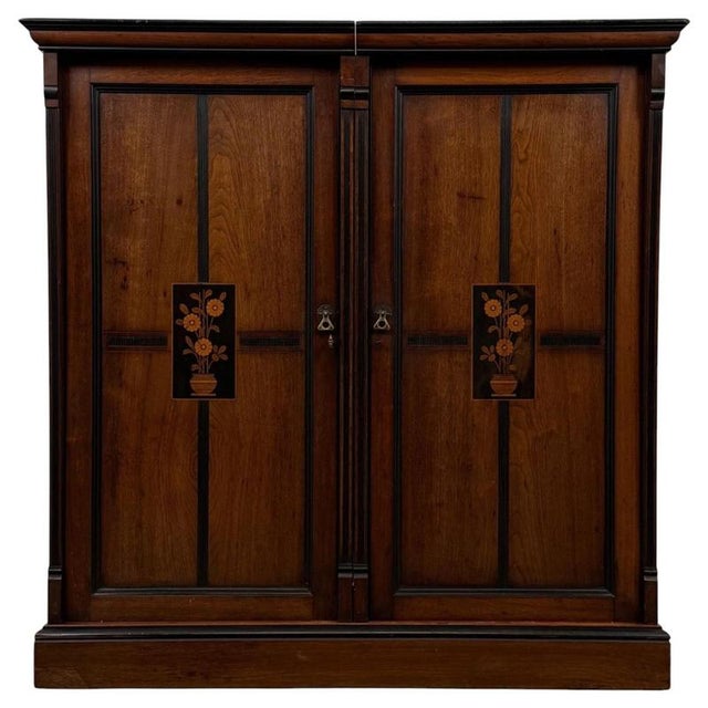 An exceptional 19th-century English cupboard in the Arts and Crafts tradition, finely constructed from mahogany and...