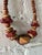 Vintage 1970s chunky Bohemian beaded necklace made from mixed wood. Features oversized geometric beads in layered tones of...