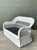 Vintage Lexington braided white rattan love seat with a gracefully contoured back and armrests, showcasing a skillful...
