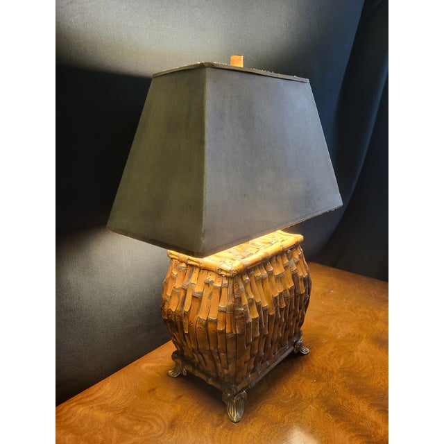 A striking vintage table lamp crafted from individually applied burnt bamboo segments in warm, richly varied tones. The...