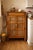 A warm and characterful vintage pine pie safe or jelly cupboard, featuring a classic drawer-over-doors configuration and...
