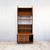 Constructed in teak veneer over a solid carcass, this Form 5 wall unit shows the recessed edge detailing and flush door...
