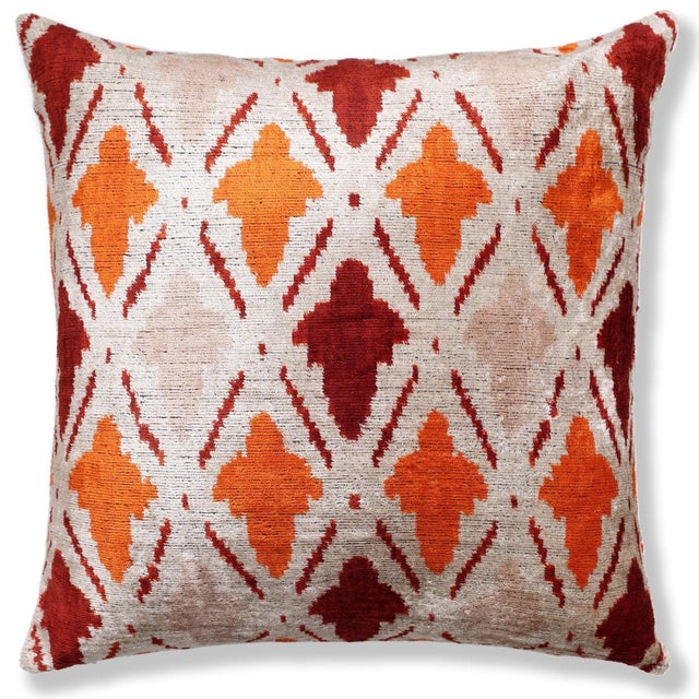 "This 20x20 inch luxury handwoven silk velvet throw pillow showcases a bold yet refined ikat-inspired motif in terracotta...