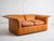 Mid-century two-seater sofa by Luigi Massoni for Poltrona Frau, distinguished by flared arm and backrests. In original...