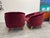 Pair of Italian 1960s club chairs newly upholstered in fine Ruby velvet . Additional cushions are included.