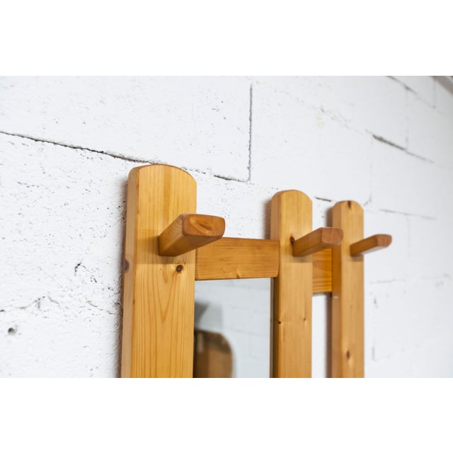 Wall-mounted coat rack in solid pine from the 1970s. Its golden finish and unique shape will add a touch of elegance to...