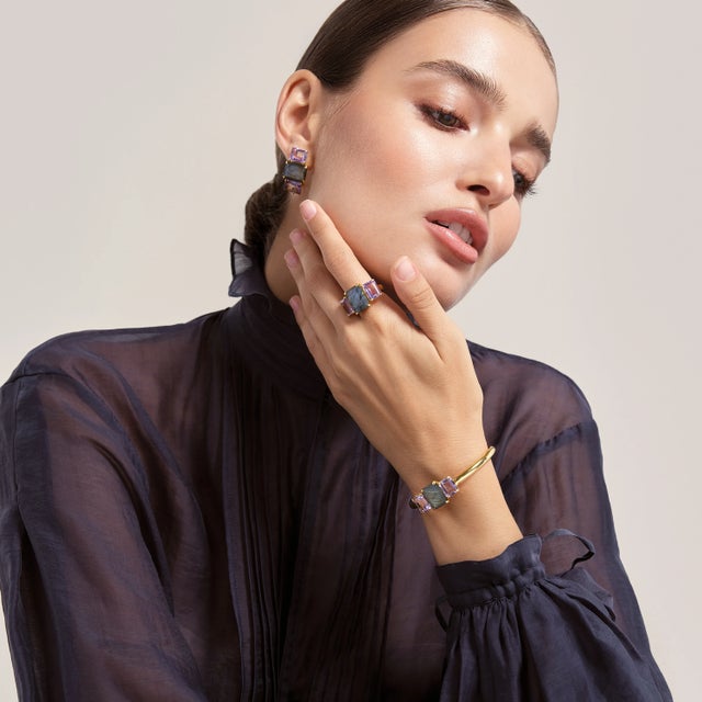 The Annette Studs showcase a classic design, with a trio of emerald-cut multi-colored stones meticulously set to create a...