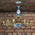 Chandelier for 15 candles, made in Louis XVI style, decorated with embossed gilded decor in the form of foliage and...