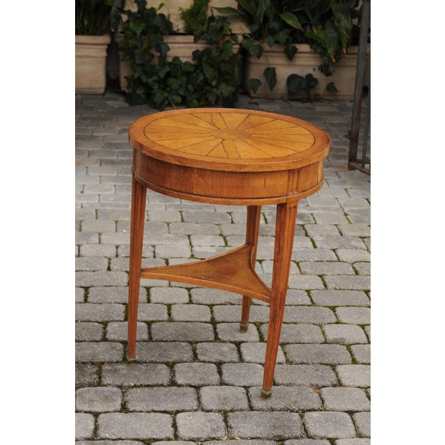 A French Napoleon III walnut guéridon side table from the mid-19th century, with radiating veneer, single drawer and lower...