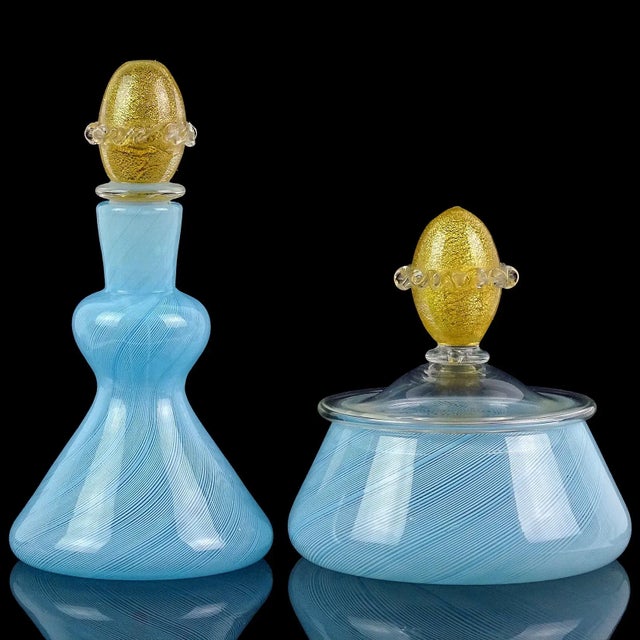 Beautiful vintage set of Murano hand blown blue ribbons and gold flecks Italian art glass vanity set. The perfume bottle...