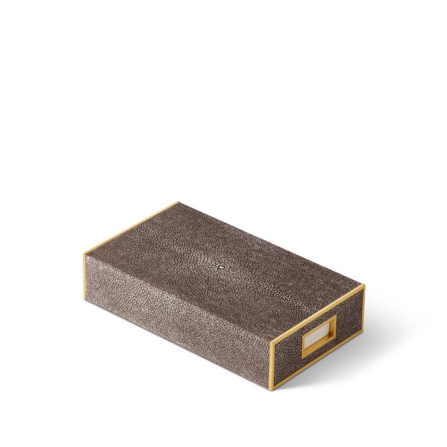 A beautiful faux shagreen box holds oversized matches and includes an opening to reveal the interior strike card. It looks...