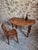 Antique walnut drop-leaf dining table from the Auvergne region of France, dating from around 1900. The table features an...