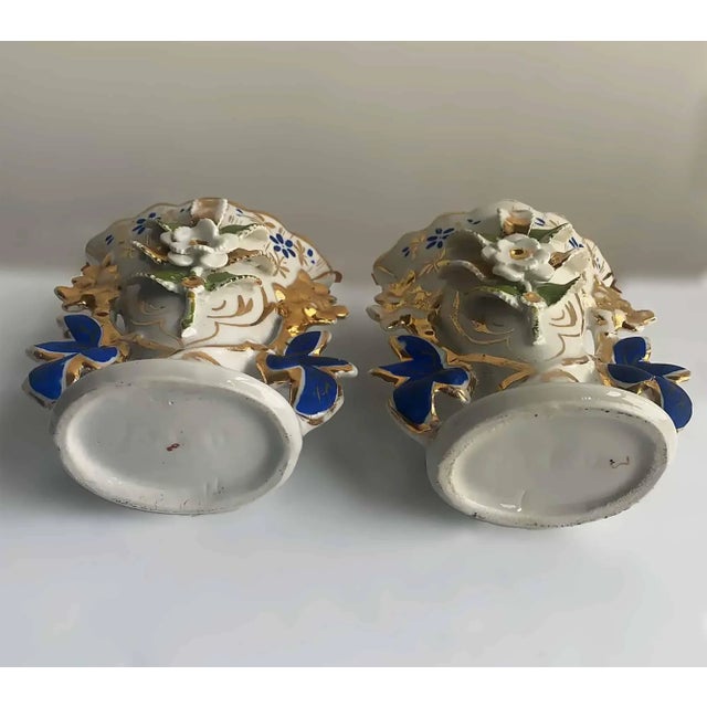 Pair of petite European vases, highly decorated with colorful hand painted glazed finish with metallic gold and white with...