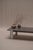 Distinctive architectural coffee table from the 1970s, combining a richly textured natural stone top with a polished...