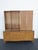 This Stunning Cabinet is made of wood, walnut, veneer, and metal. The piece was made by John Widdicomb, and it is stamped....