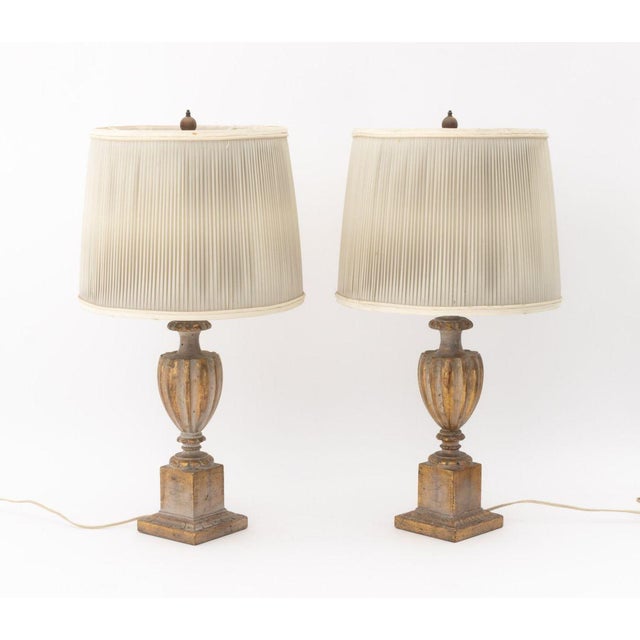 Pair of Neoclassical Urn Form Giltwood Table Lamps, fluted urn on square plinth, pleated cloth shades. Overall: 26" H x...