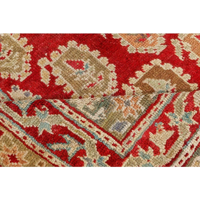 Bold, regal, and richly decorative, this antique Turkish Oushak rug exemplifies the artistic mastery and opulent color...