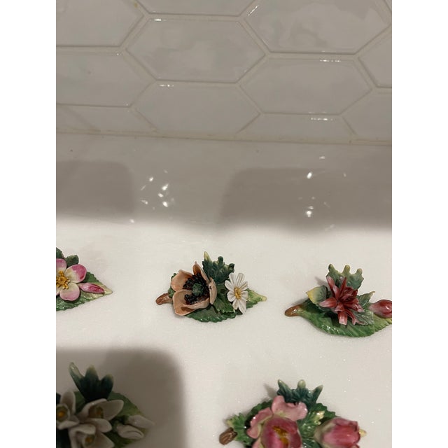 High quality Dresden porcelain floral place card holders. This is a set of 11 with different flowers on each. Each card...