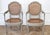 19th century painted and carved ribbon cane back open armchairs painted in a soft pale Swedish gray color, with natural...