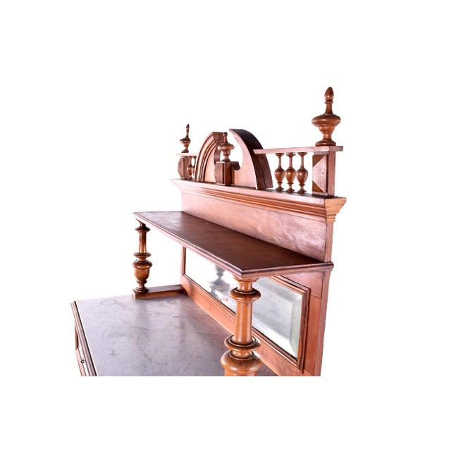 Sideboard Henry II style in solid walnut. Lower body with 2 shelves and 2 drawers with carvings, marble top....