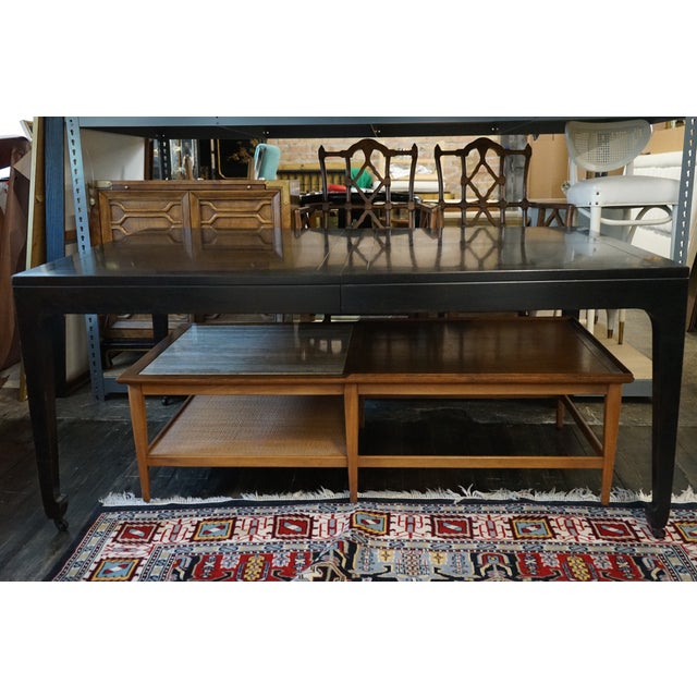 A timelessly designed dining table that Michael Taylor did for Baker Furniture. This table starts out as a rectangle but...