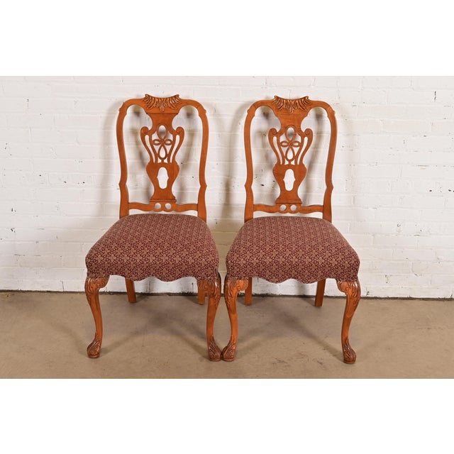 An outstanding pair of antique Georgian, Chippendale, or Queen Anne style side chairs or dining chairs By Romweber USA,...