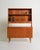 Teak bookcase with pull-out shelf, storage compartment, and integrated drawers. Scandinavian production, 1960s. Designed...