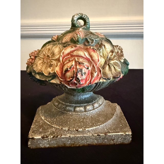 This floral doorstop by the C.J.O. Judd Company is a very rare find. The colorful doorstop boasts all original paint and...
