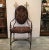 Handsome hand forged wrought iron and burnished brass chair with printed sturdy weight armorial fabric. The frame is solid...