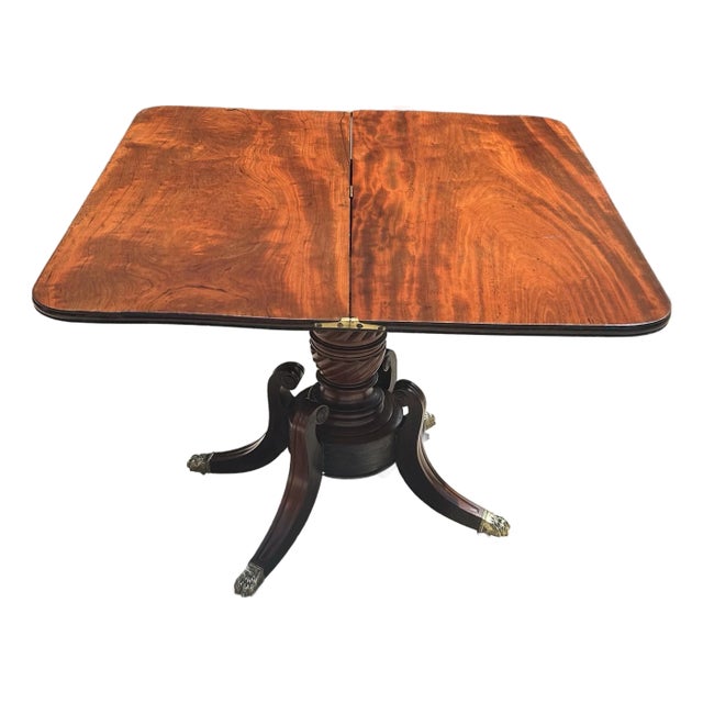 Antique Flame Mahogany, Regency-Style, Flip-Top, Rotating, Game Table, W/Hidden Drawer, Carved Pedestal, Brass Claws and Casters. C1810 to 1820 For Sale