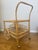 Elevate your space with this authentic vintage rattan bar cart from the 1970s, a true mid-century modern gem. With its...