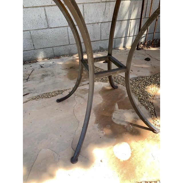 Mosaic Tiled Garden Table on solid wrought iron base.