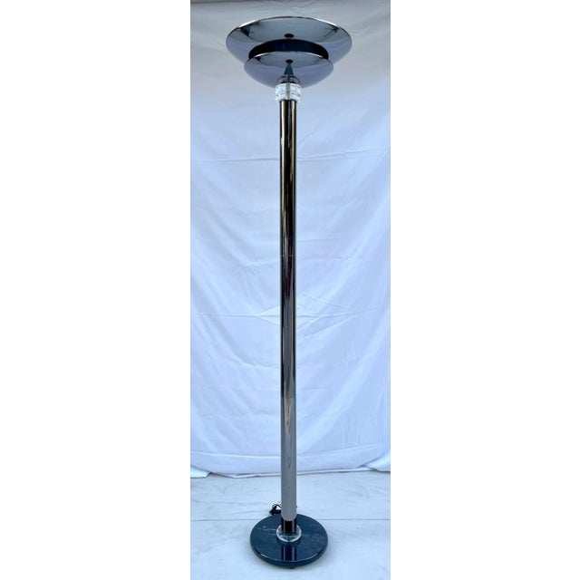 Here is a stunning floor lamp made in 1992 featuring a Postmodern shape/feel with a chromed metal body, lucite details and...