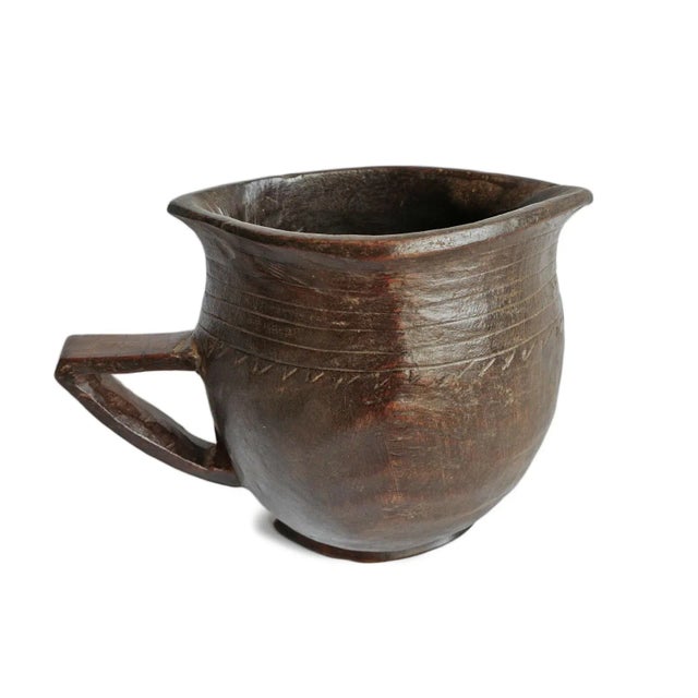 Vintage handmade village pitcher from North Africa. Rich dark wood with original traditional geometric carved details....