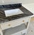 Original retail $9760, stylish Made Goods Modern Gray Linen Double Sink Vanity, black marble top, showroom floor sample
