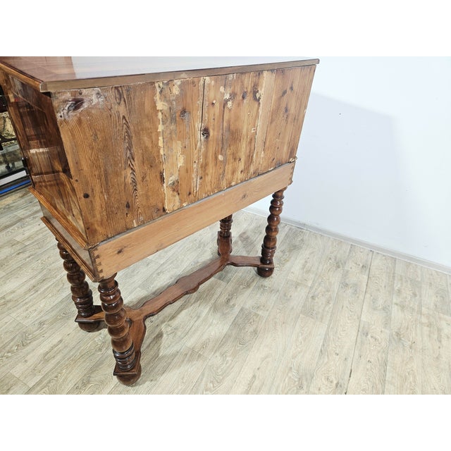 This offer features an elegant, antique cabinet dating back to the second half of the 19th century, crafted with...