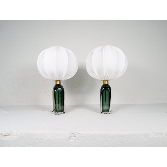 Table lamp in crystal, model rd1406 by carl fagerlund for orrefors, sweden. The lamps have a stunning green color with...